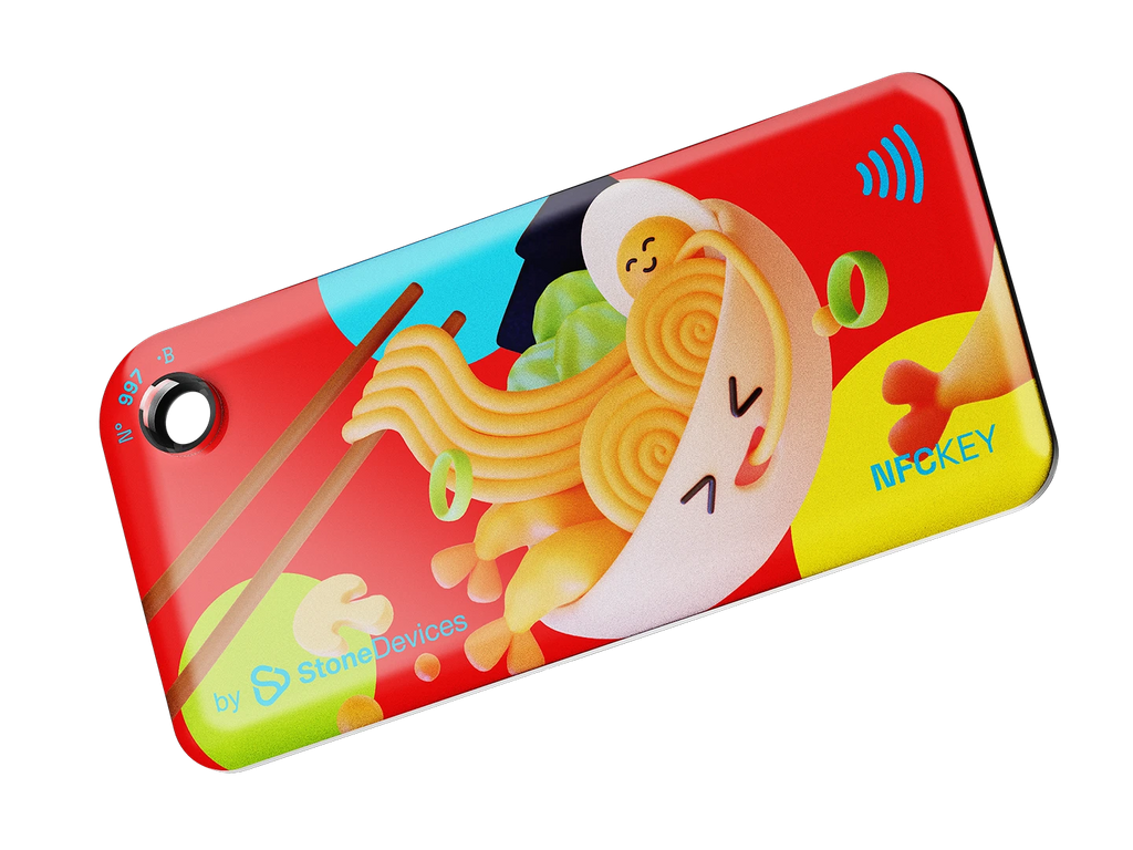 NFC key fob with 3D cartoon ramen bowl and chopsticks design on a red background with colorful circles