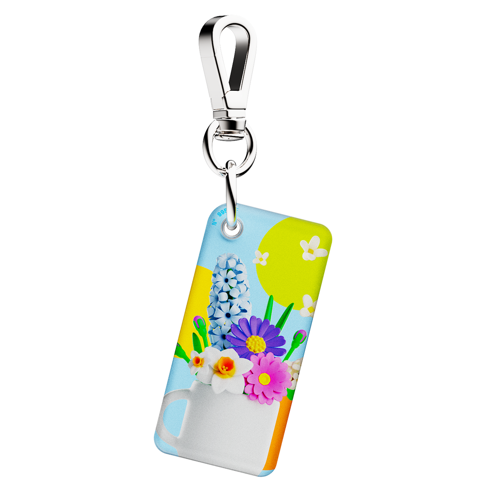 NFC keychain with 3D cartoon multicolor flowers inside a white cup design on a light blue background 