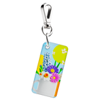 NFC keychain with 3D cartoon multicolor flowers inside a white cup design on a light blue background 