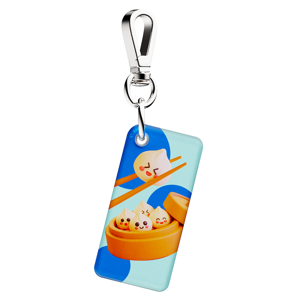 NFC keychain with 3D cartoon dumplings design on a light blue background with blue dots