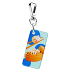 NFC keychain with 3D cartoon dumplings design on a light blue background with blue dots